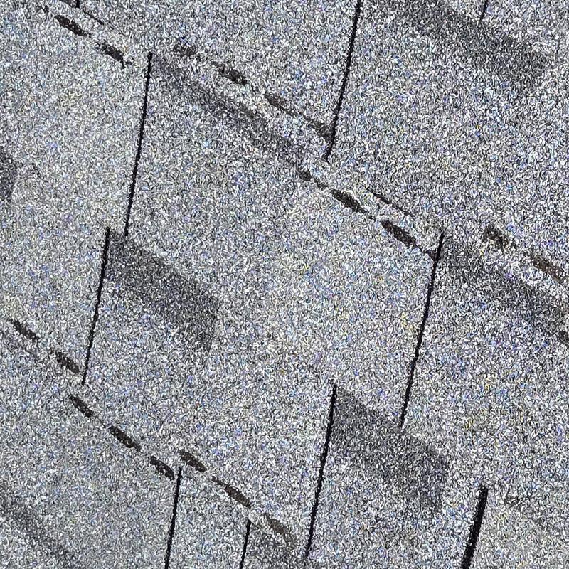 Asphalt shingles with storm damage discoloration Asphalt shingles with storm damage discoloration