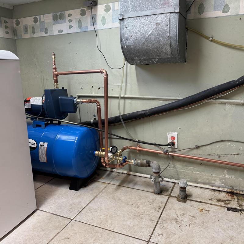 Shallow well pump and bladder tank installation