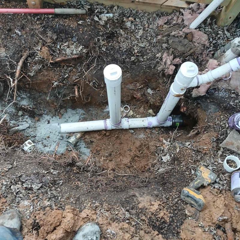 PVC sewer clean out excavation with piping installation