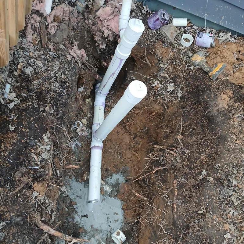 PVC crossfire clean out installation in excavated soil
