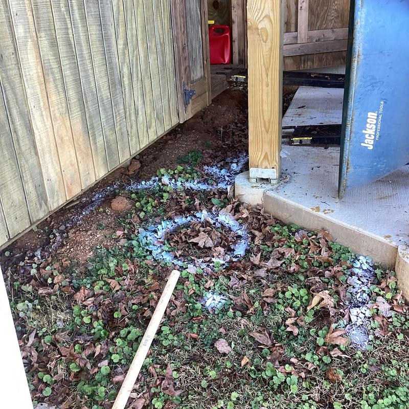 Septic tank location marked with white spray paint