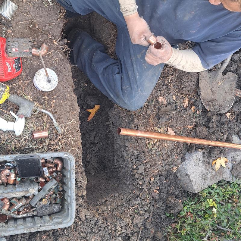 Copper water pipe installation in ground trench Copper water pipe installation in ground trench