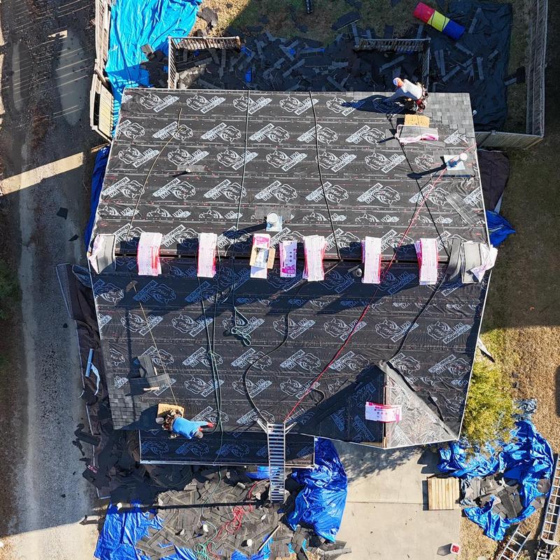 Roof underlayment installation on residential home