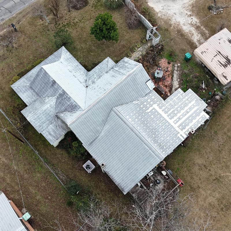 Metal roof with patching and storm damage inspection