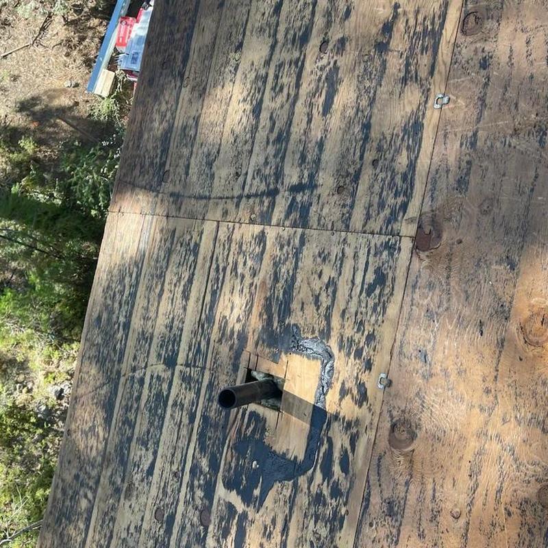 Roof plywood deck with pipe flashing installation