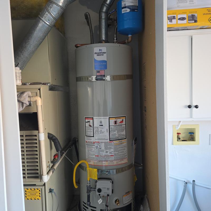 Water heater installation with expansion tank and straps