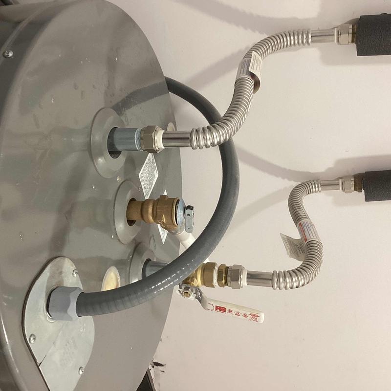 Water heater pop-off valve with connected pipes