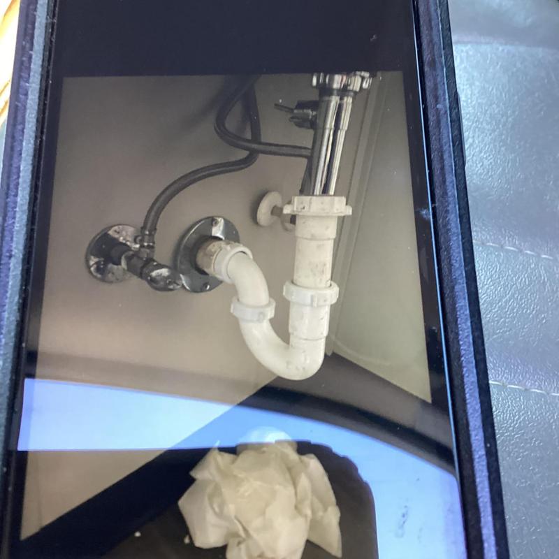 Bathroom sink P-trap with drain and supply lines installed