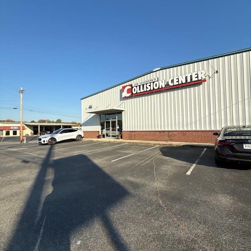 Collision center building exterior and parking lot