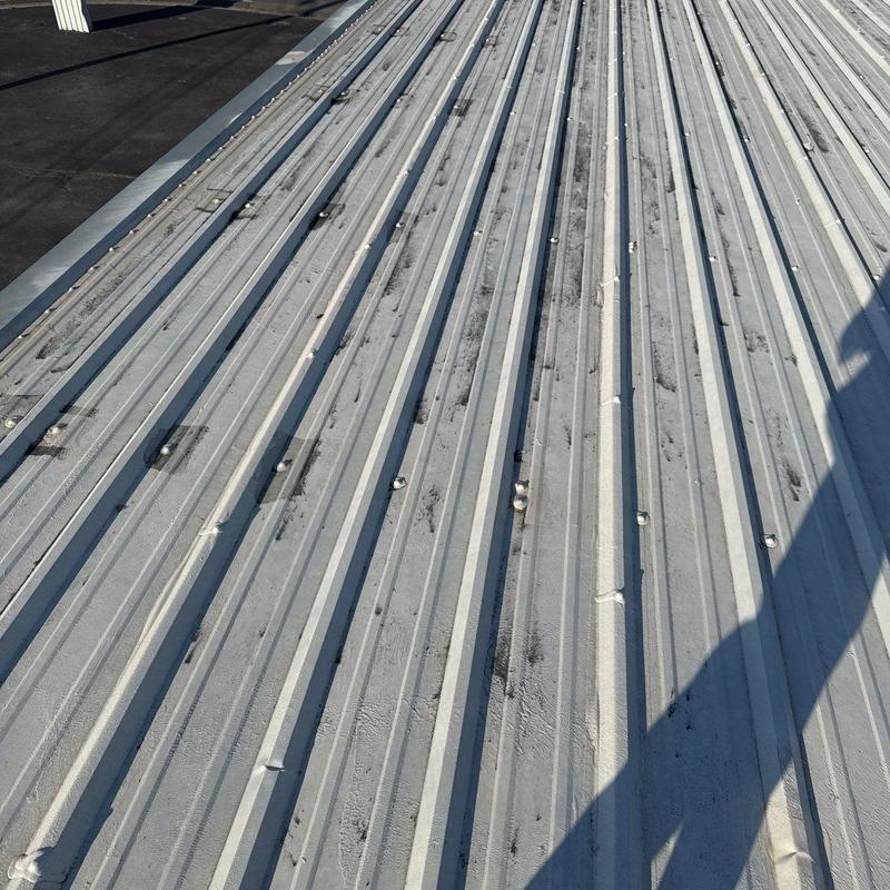 Metal roof panels with fasteners and shadows