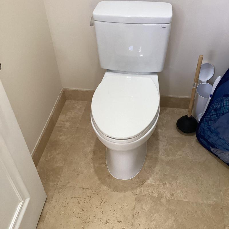 Toto toilet installation in bathroom corner