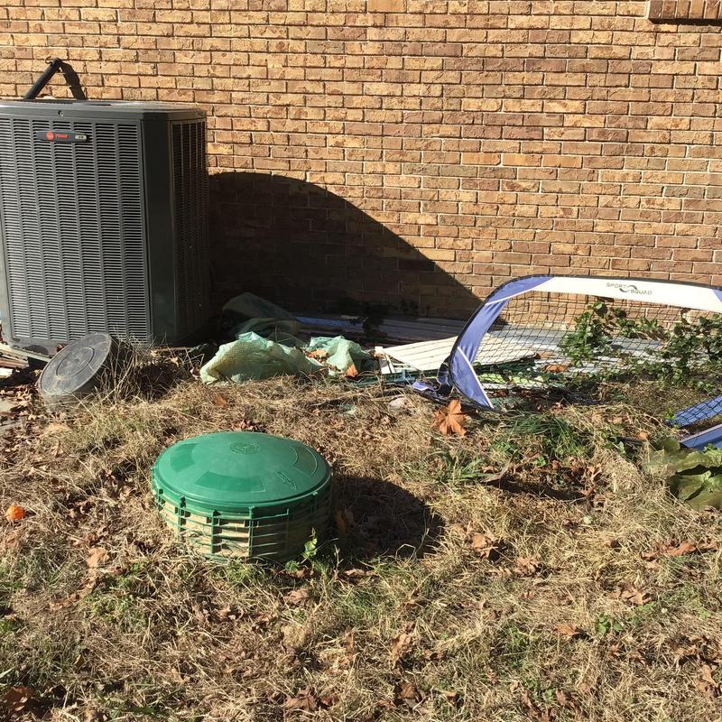 Field line valve box near outdoor air conditioner unit