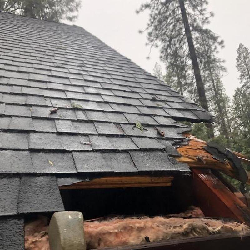 Roof shingles and wooden frame storm damage in Avery, CA
