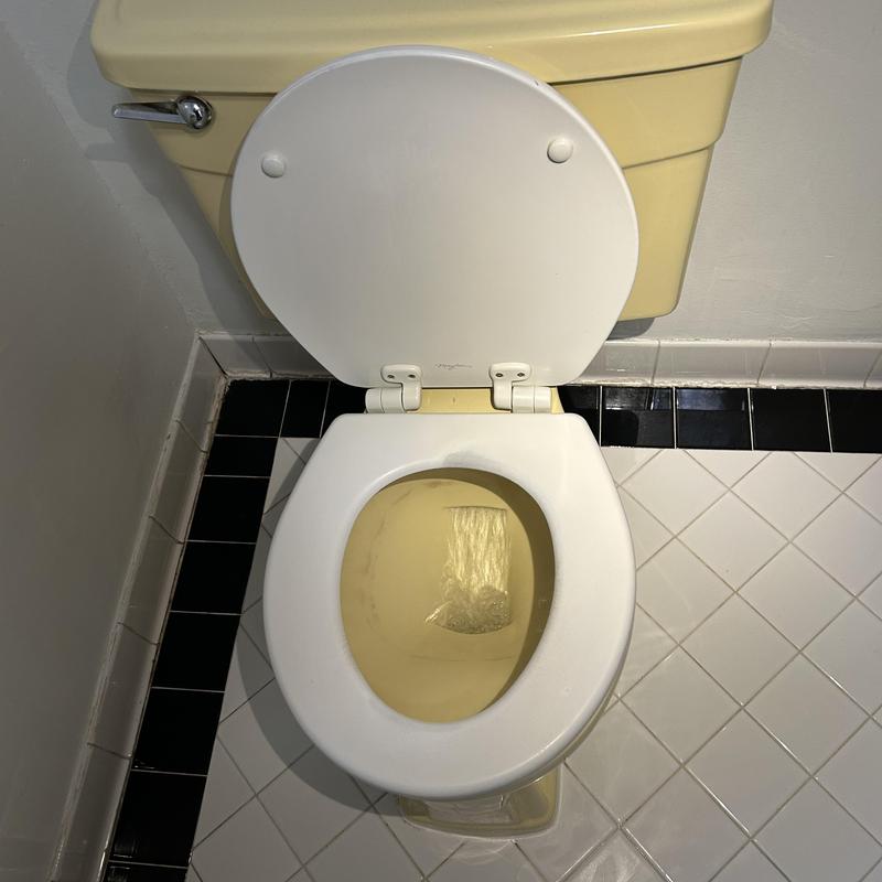 Toilet with resealed base and clear water flow