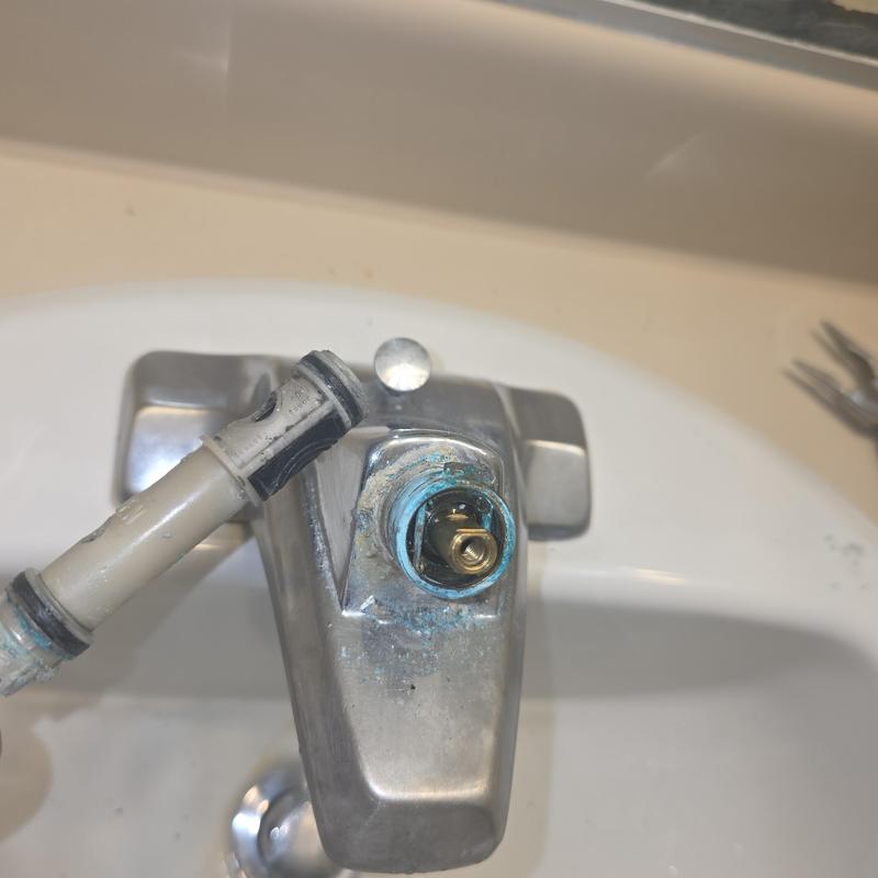 Bathroom faucet cartridge installation with corrosion buildup