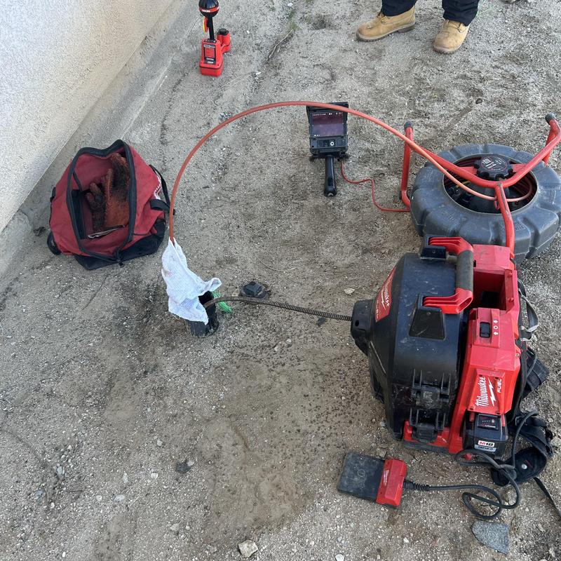 Sewer drain cleaning machine with camera on dirt ground