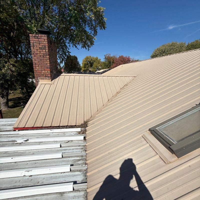 Metal roof panels with sealed seams and flashing