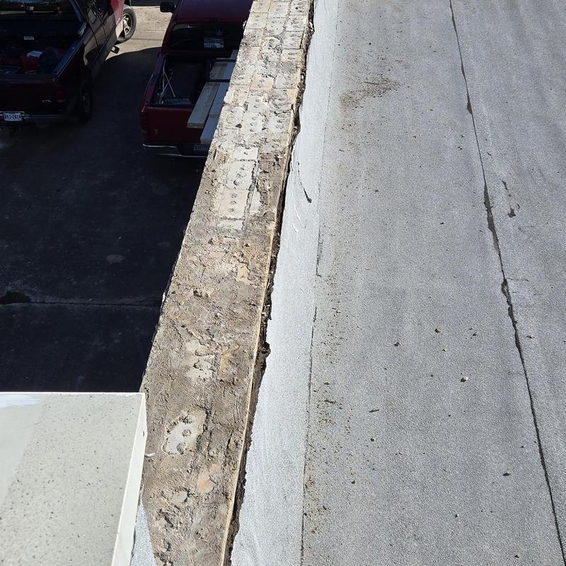 Roof edge and membrane with visible wear and damage Roof edge and membrane with visible wear and damage