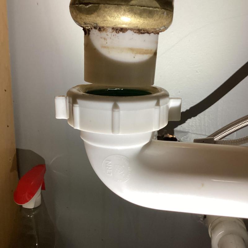 Kitchen sink drain pipe reassembly under cabinet