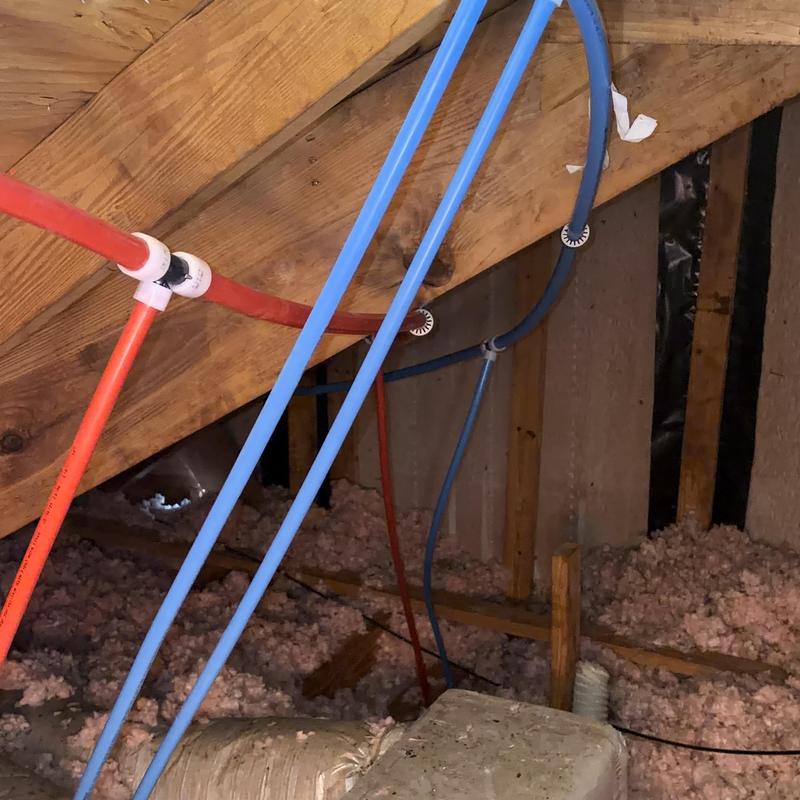 PEX A piping installation in attic plumbing system