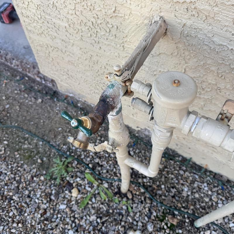 Hose bib replacement with backflow preventer on wall