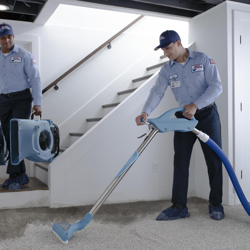Carpet water extraction with drying equipment in basement