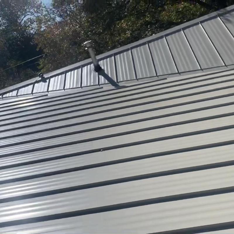 Bone white striated metal standing seam roof panels