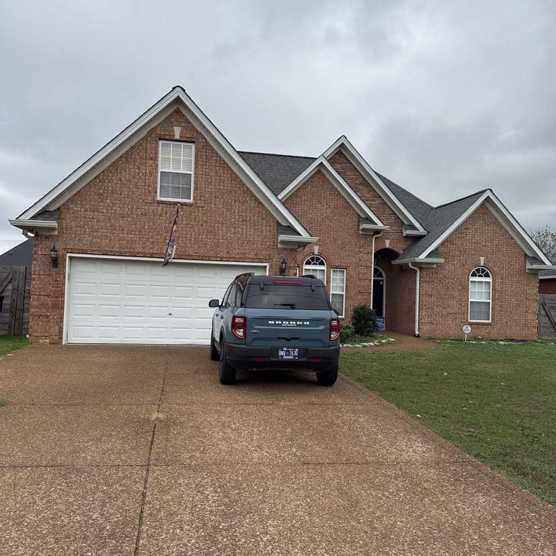 Asphalt shingle roof with hail damage inspection