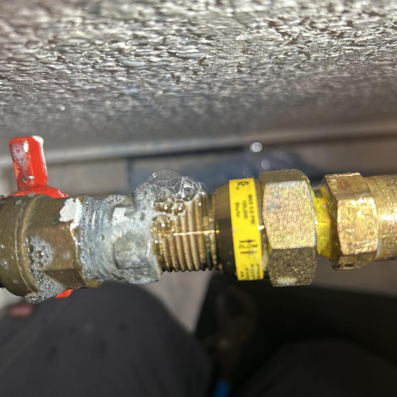 Gas line with leaking connections showing air bubbles