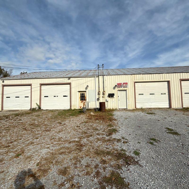 Metal warehouse roof with rust and wear signs