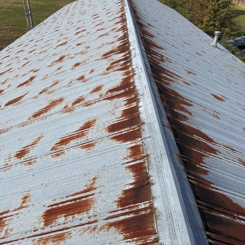 Metal roof rust spots and ridge cap inspection