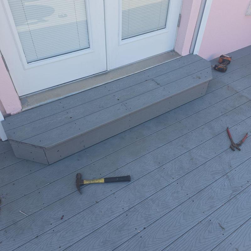 Door steps construction with gray decking boards Door steps construction with gray decking boards