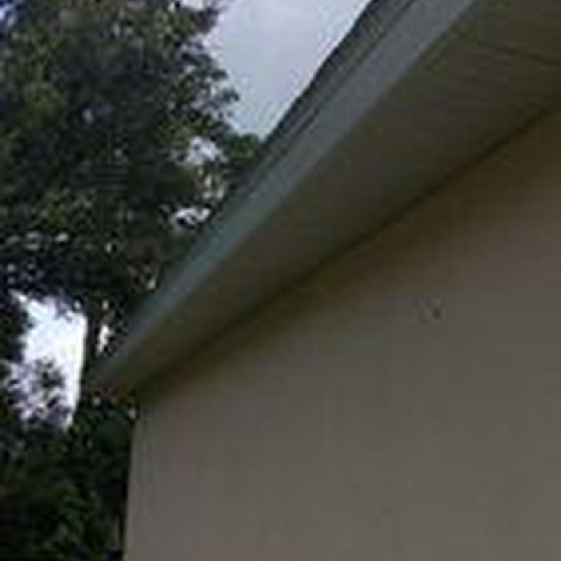 Fascia reinstall along roof edge on house exterior Fascia reinstall along roof edge on house exterior