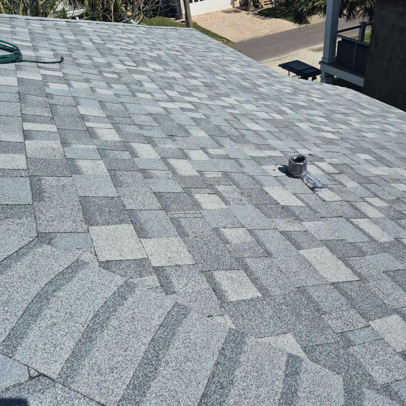 Asphalt shingle roof with vent pipe installation Asphalt shingle roof with vent pipe installation