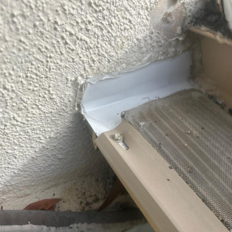 Metal diverter installed at gutter and roof edge Metal diverter installed at gutter and roof edge