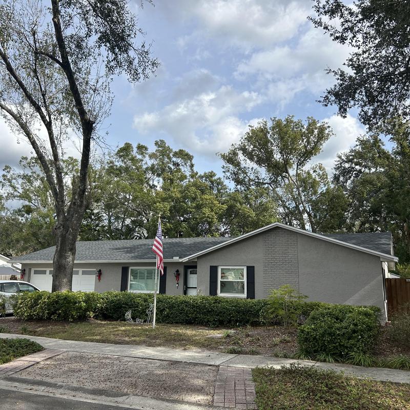 Landmark shingle roof and soffit on gray home