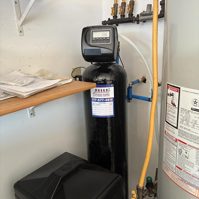 Water softener system with digital control panel installed