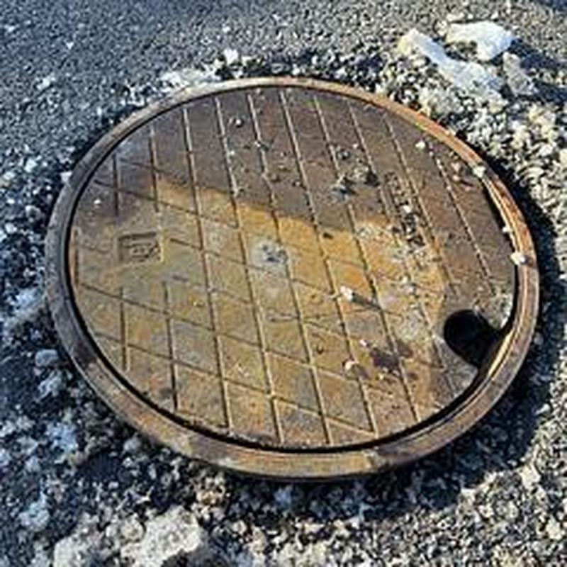 Traffic rated clean out cover in parking lot