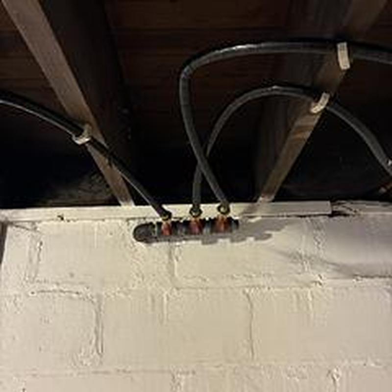 Gas pipe manifold with new black iron tubing installation