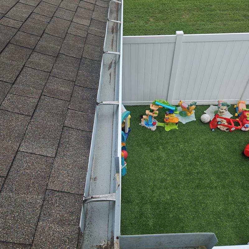 Gutter system above backyard play area, cleaned of debris Gutter system above backyard play area, cleaned of debris