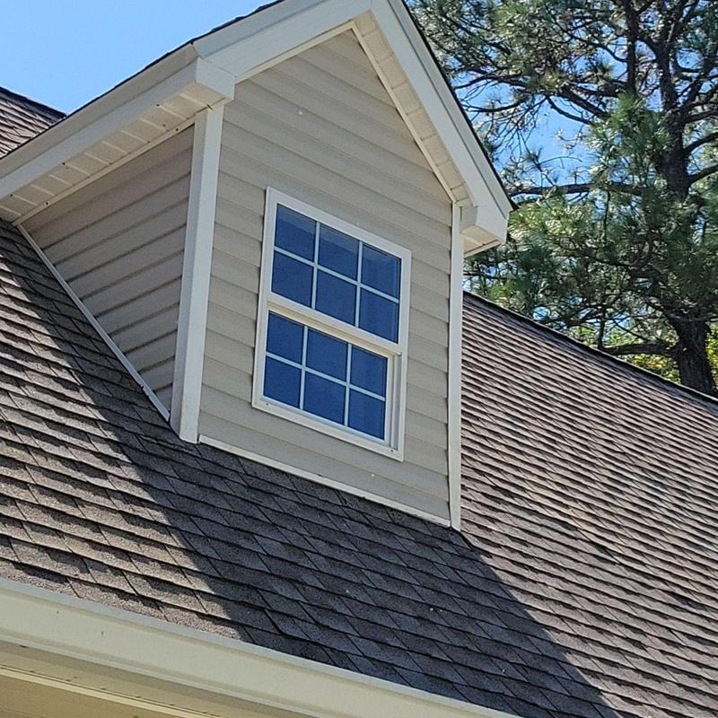 Roof shingles and siding on repaired dormer window Roof shingles and siding on repaired dormer window