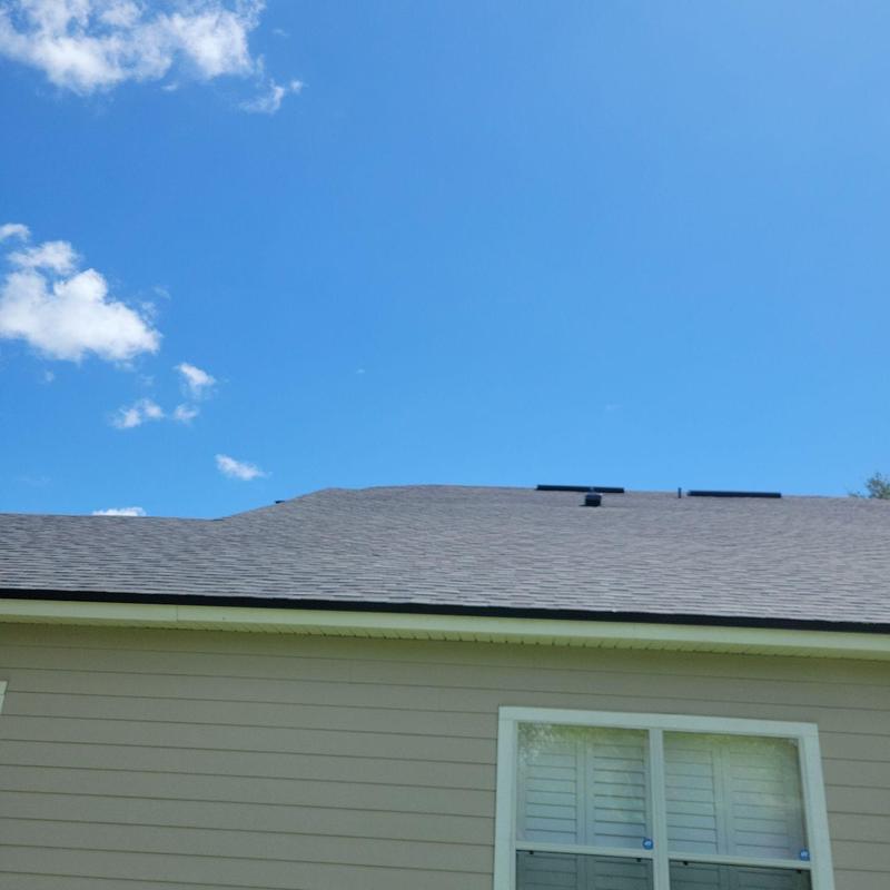 Asphalt shingle roof with vent pipes on house Asphalt shingle roof with vent pipes on house