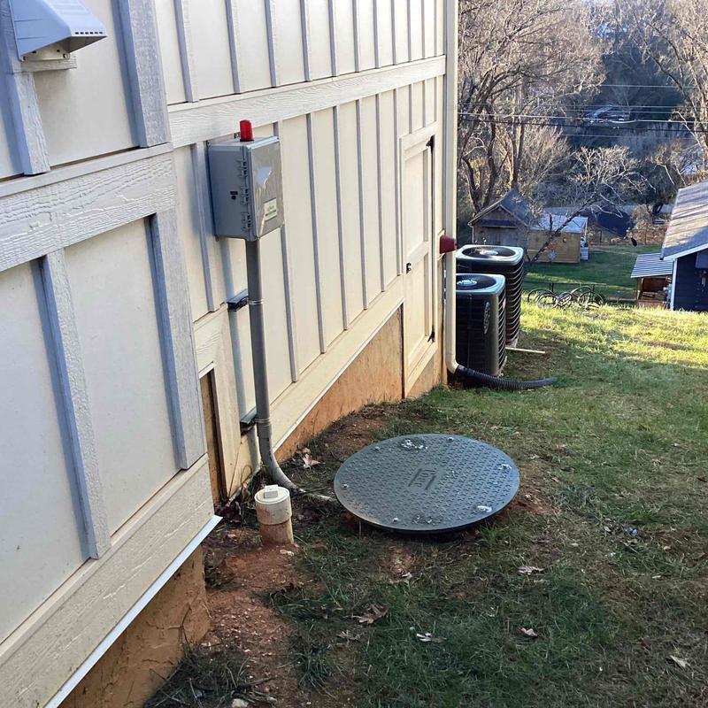 Float switch control panel and septic tank system outdoors