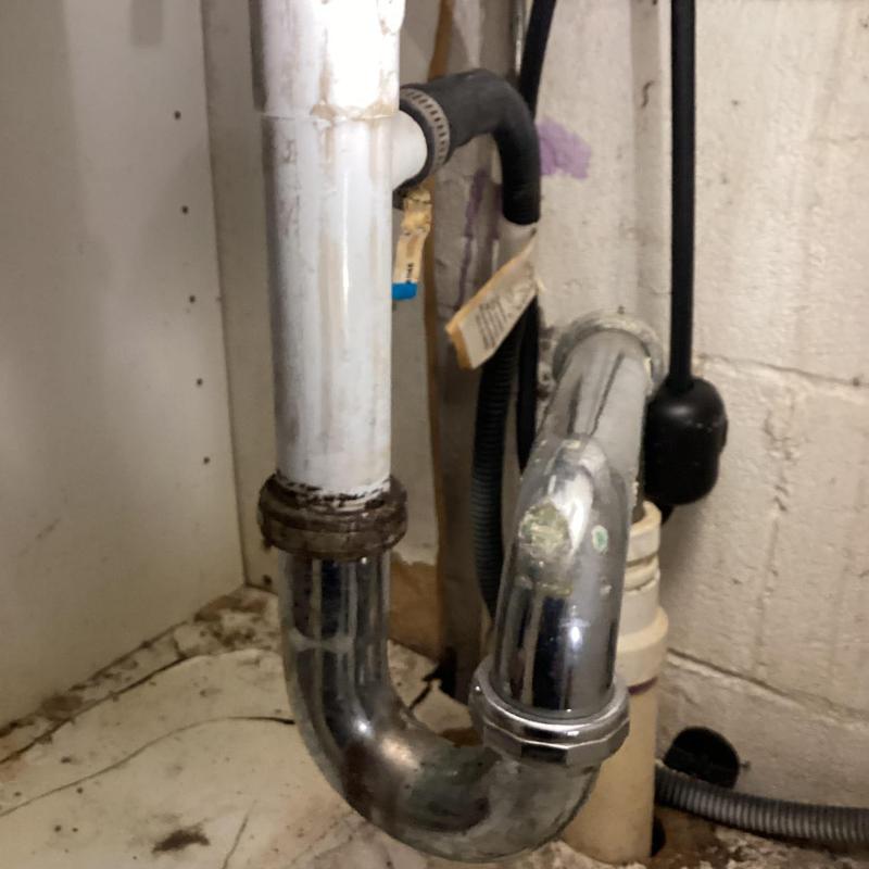 Faucet supply line and drain pipe connection under sink