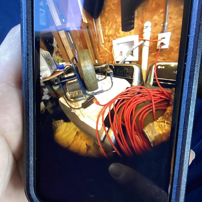 Washing machine drain line with plumbing cable in laundry room