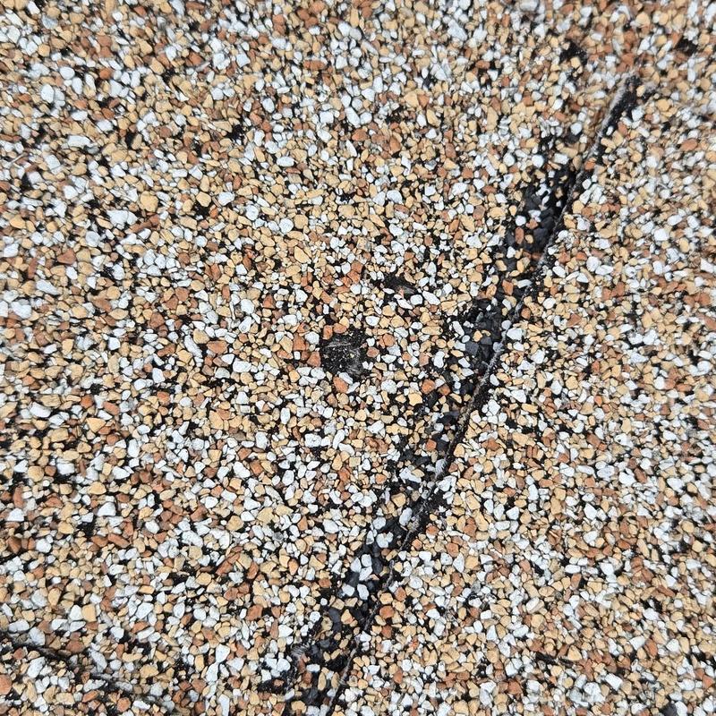 Asphalt shingle roof granule loss from hail damage