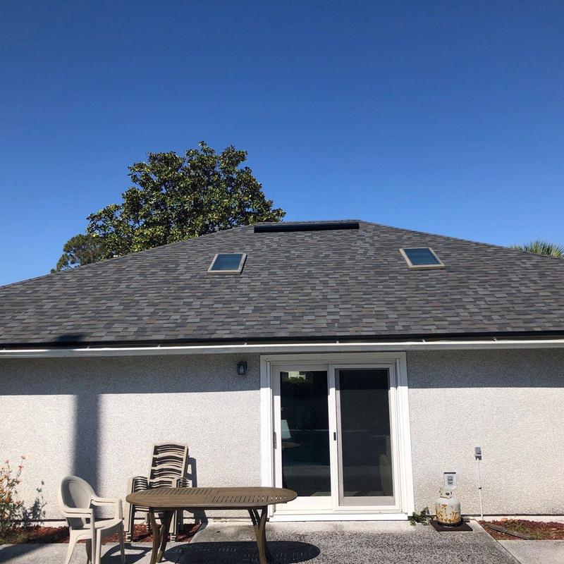 Asphalt shingle roof with skylights on residential home Asphalt shingle roof with skylights on residential home