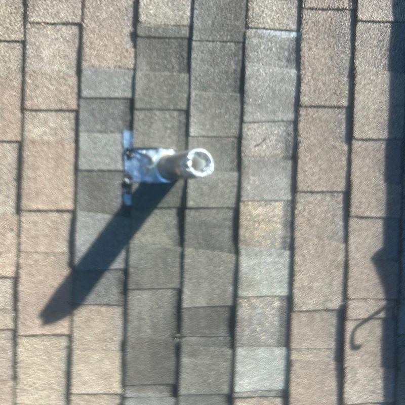 Plumbing boot and replacement shingles on roof Plumbing boot and replacement shingles on roof