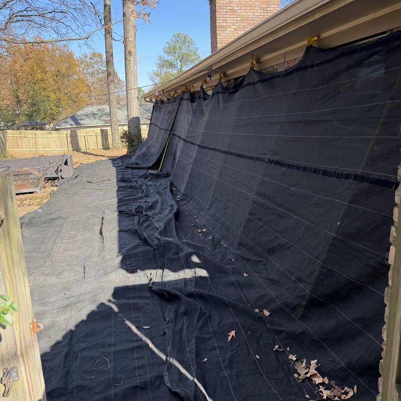 Roofing catch all system installation along house wall Roofing catch all system installation along house wall