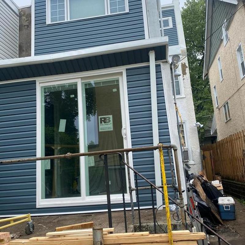 Vinyl siding installation with sliding glass door